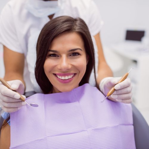 female-patient-smiling-in-clinic-min